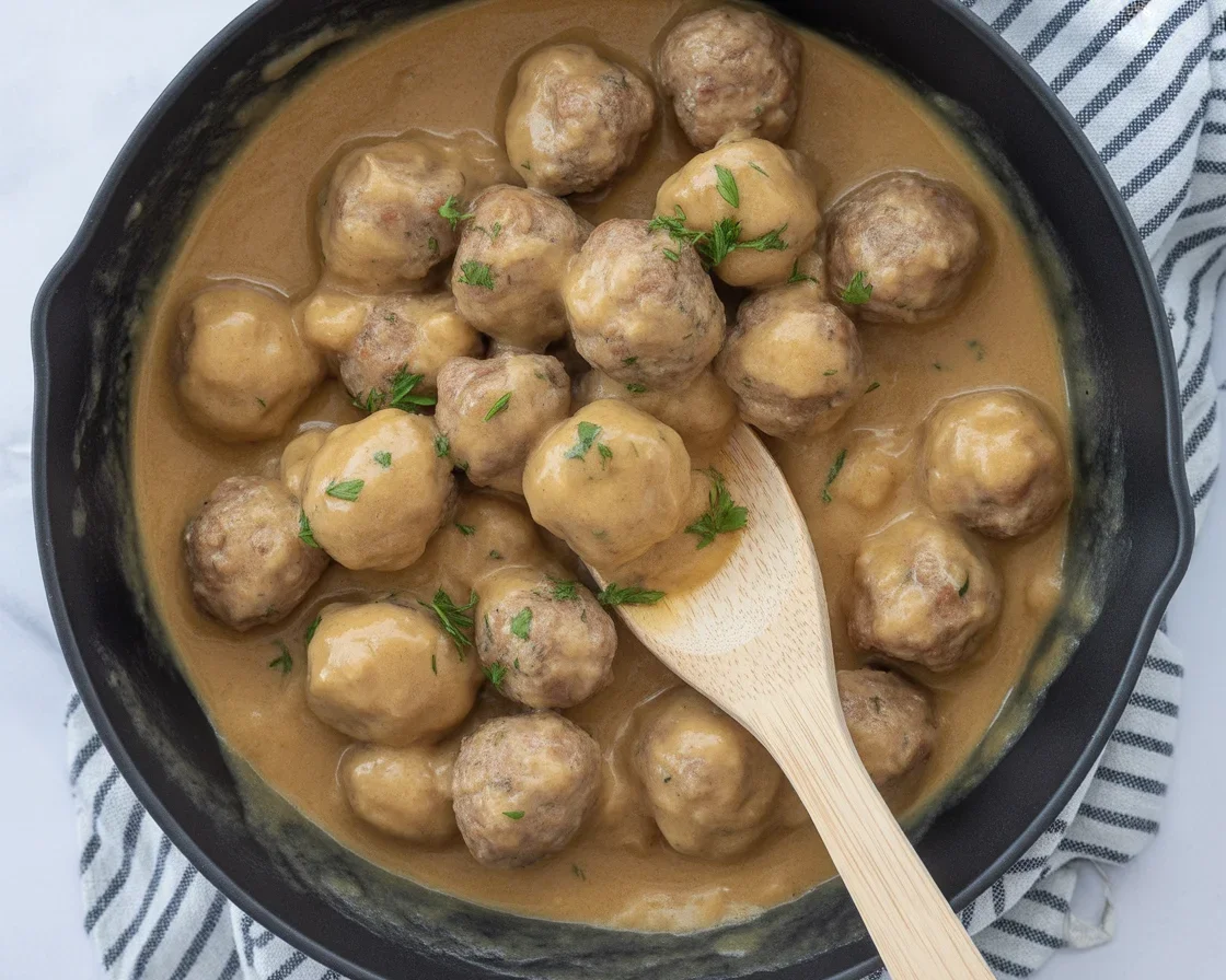 Healthy Ground Turkey Swedish Meatballs cooked in creamy sauce with herbs.