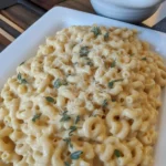 Creamy Parmesan Garlic Chicken Mac And Cheese cooked in a slow cooker with pasta.