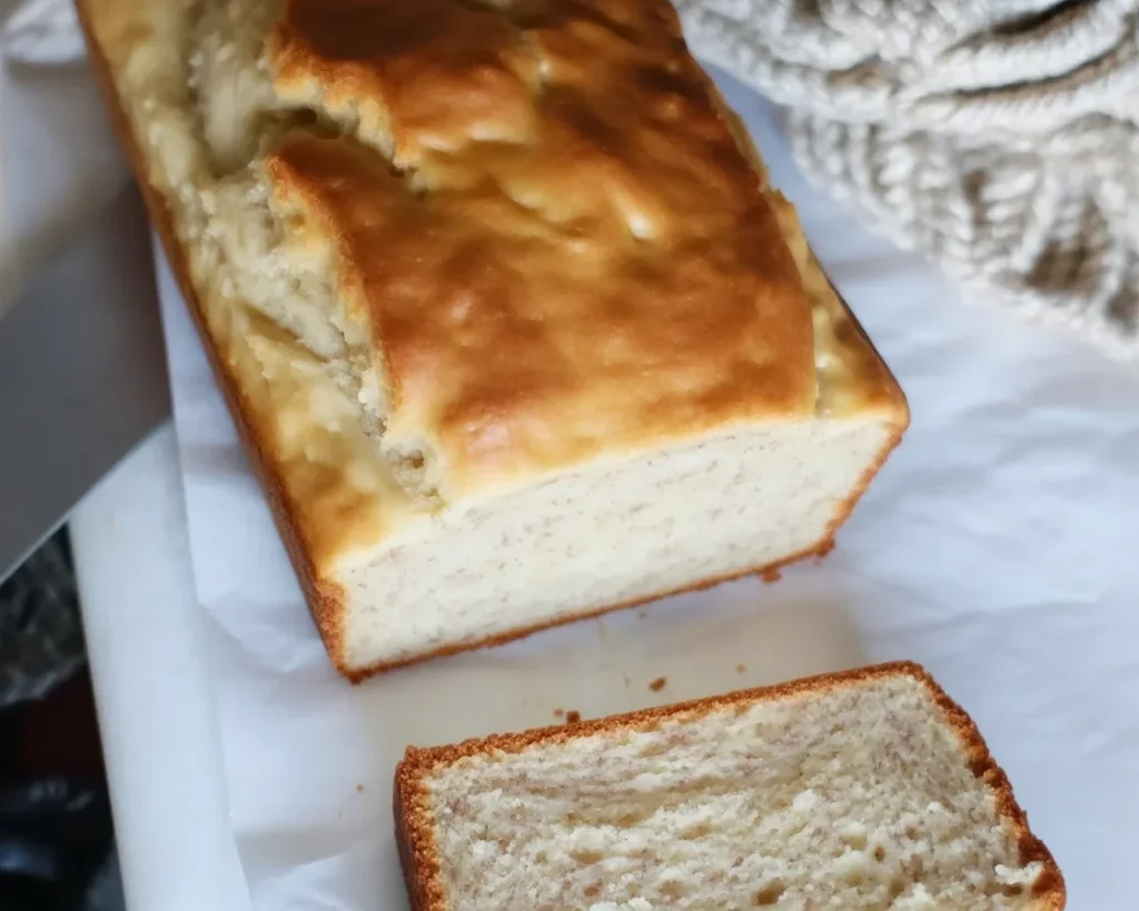 Three-ingredient banana bread made with ripe bananas, self-rising flour, and condensed milk.