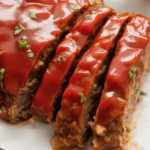 Homemade Cracker Barrel Meatloaf with ingredients like ground beef, Ritz crackers, and peppers.