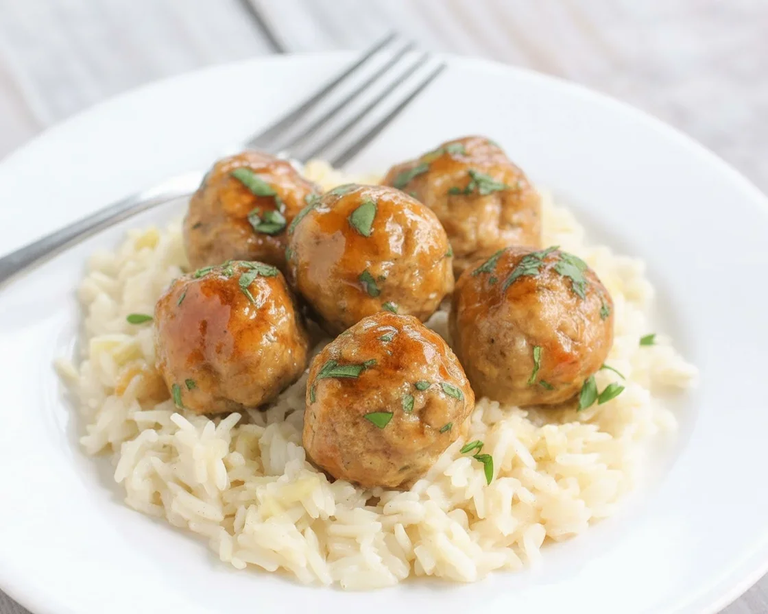 Delicious Honey Garlic Turkey Meatballs in a sticky sauce served with coconut rice.