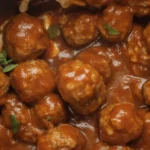 Slow Cooker Salisbury Steak Meatballs in rich gravy served on a plate