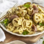 Philly cheesesteak tortellini served with provolone cheese and fresh vegetables