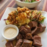 Delicious garlic butter steak bites in a skillet, served as a quick dinner option.
