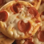 Mini Deep Dish Crescent Roll Pizzas baked in muffin tin with pizza sauce and cheese