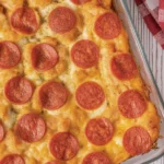 Delicious Tater Tot Pizza Casserole with ground beef and pizza sauce topped with cheese