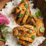 Delicious Thai Coconut Grilled Chicken skewers with vibrant garnishes.