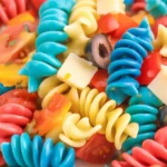 Colorful 4th of July Pasta Salad with vibrant red, white, and blue ingredients.