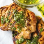 Juicy Chimichurri Chicken Thighs served with flavorful chimichurri sauce