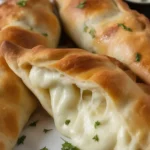 Crispy Chicken Alfredo Air Fryer Calzones filled with creamy sauce and tender chicken.