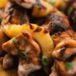 Grilled Hawaiian Huli Huli Chicken with savory pineapple sauce and fresh ingredients.