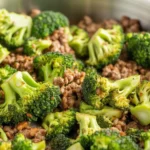 Keto Hamburger and Broccoli Skillet with cheese and ground beef in a skillet.