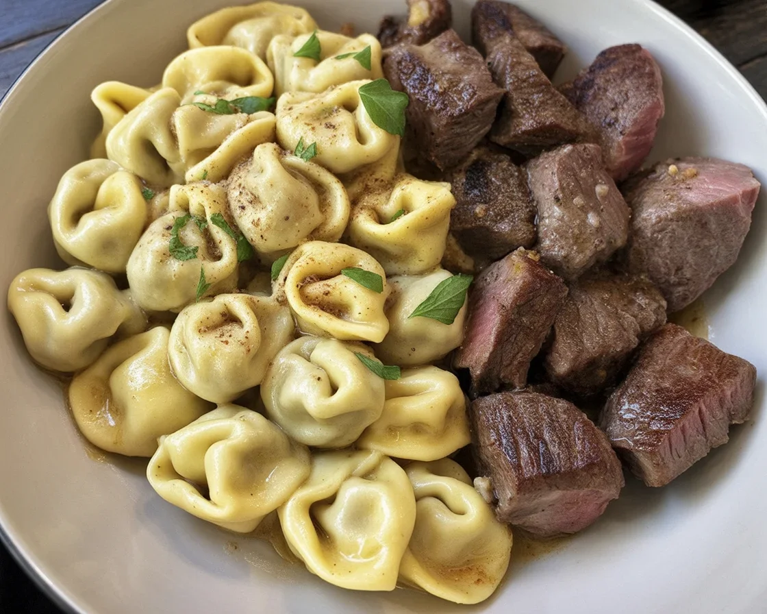 Delicious Garlic Butter Steak Bites served with Creamy Pesto Alfredo Tortellini