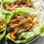 Asian Style Ground Beef Lettuce Wraps with seasoned meat and fresh veggies in lettuce cups.