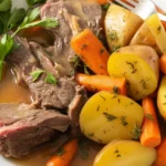 Delicious pot roast with tender potatoes and carrots in a rich gravy