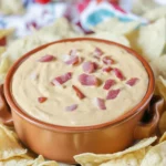 Delicious Sizzling Bacon Cheeseburger Queso Dip served with tortilla chips