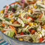A vibrant Southwest Cabbage Salad with fresh veggies and black beans in a creamy dressing.