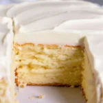Delicious Cream Cheese Cake topped with frosting and fruit, perfect for dessert