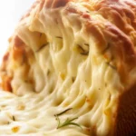 Freshly baked Rosemary Garlic Pull Apart Bread with garlic, butter, and herbs.