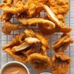 Crispy Fried Oyster Mushrooms served as an appetizer, vegan-friendly dish.