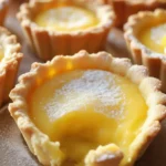 Mini Baby Lemon Impossible Pies with a creamy custard texture and a golden crust.