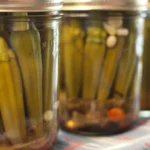 Homemade pickled okra jars filled with flavorful spices and fresh ingredients