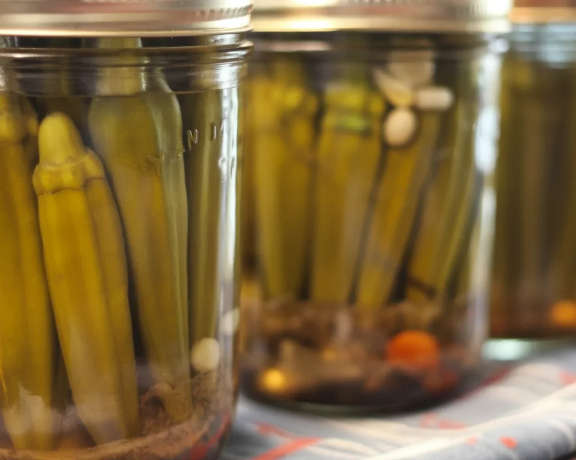 Homemade pickled okra jars filled with flavorful spices and fresh ingredients