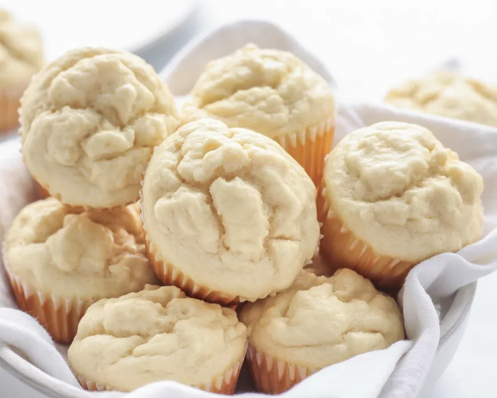 Platter of delicious Cream Cheese Muffins with a moist crumb and creamy filling.