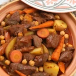A delicious plate of Moroccan Beef Tagine with fragrant spices and vegetables.